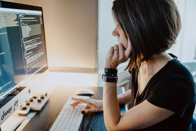 woman programming on a computer