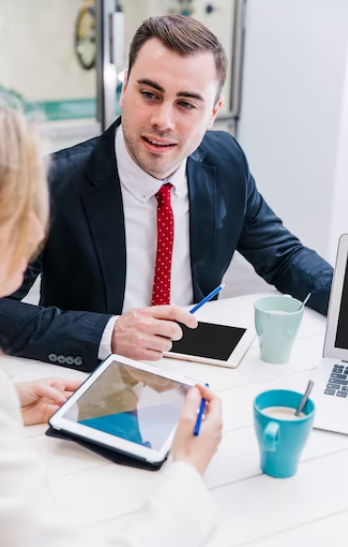 lawyer discussing with other lawyer over documents with ipad